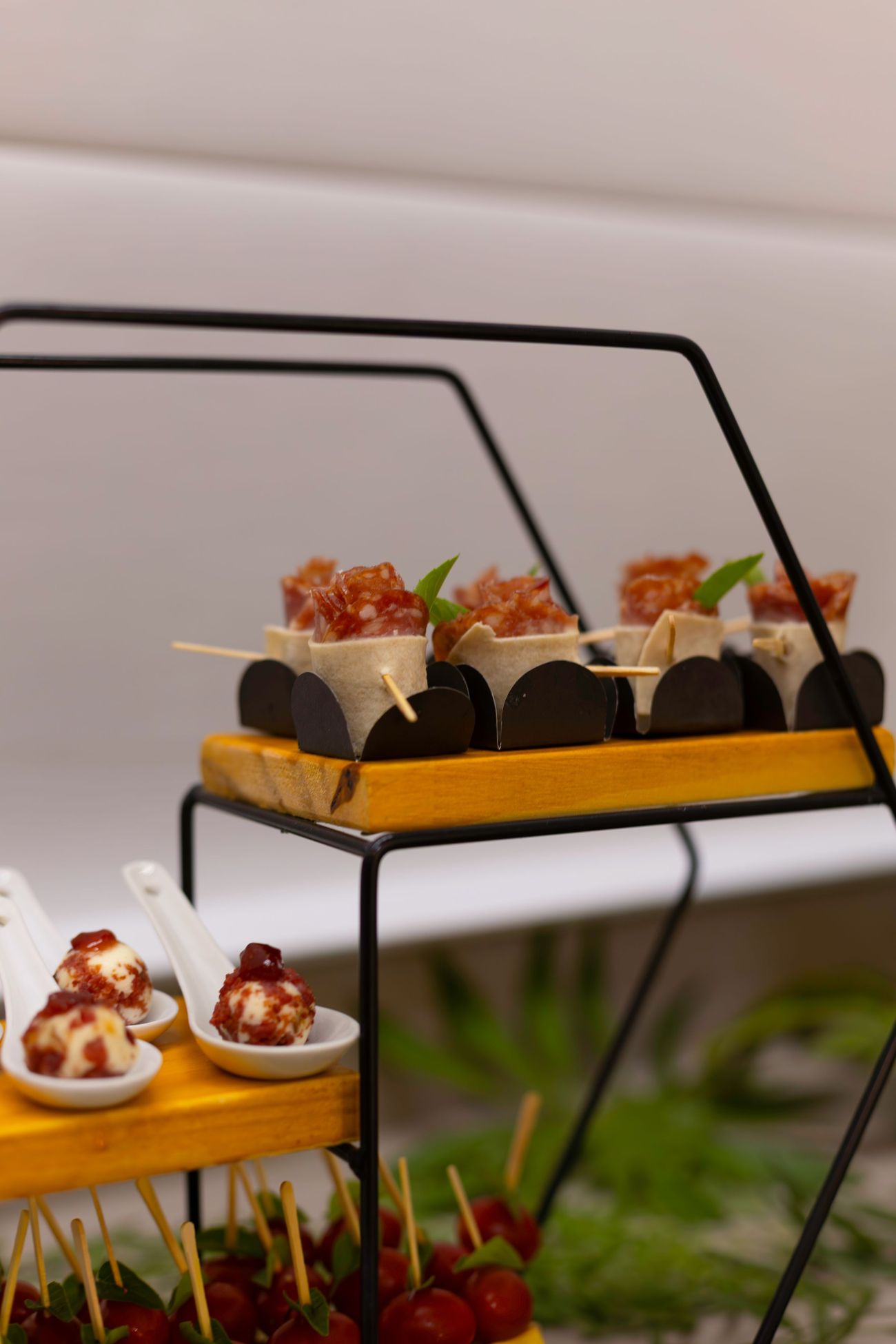 Canap&eacute;s set out on a tiered stand, ready to be passed